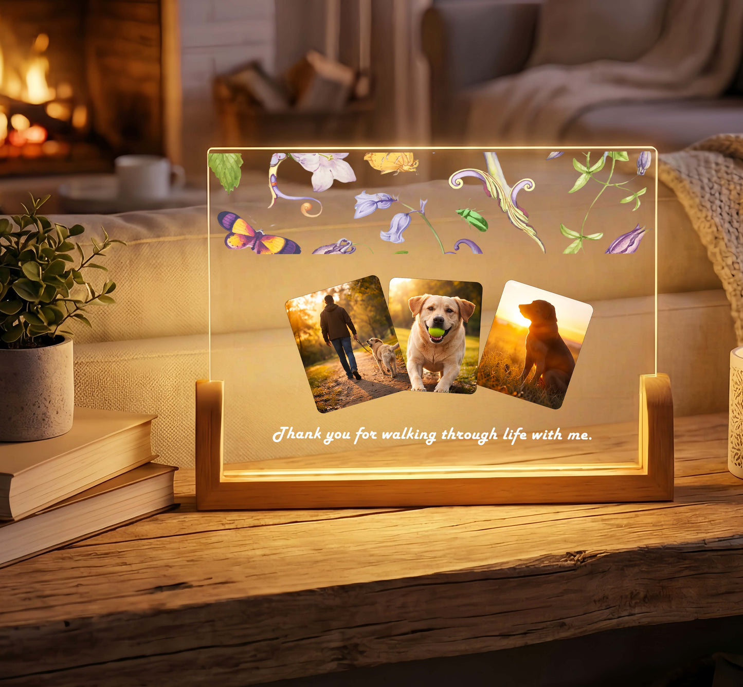 Personalized dog memorial photo lamp glowing warmly on a living room table.