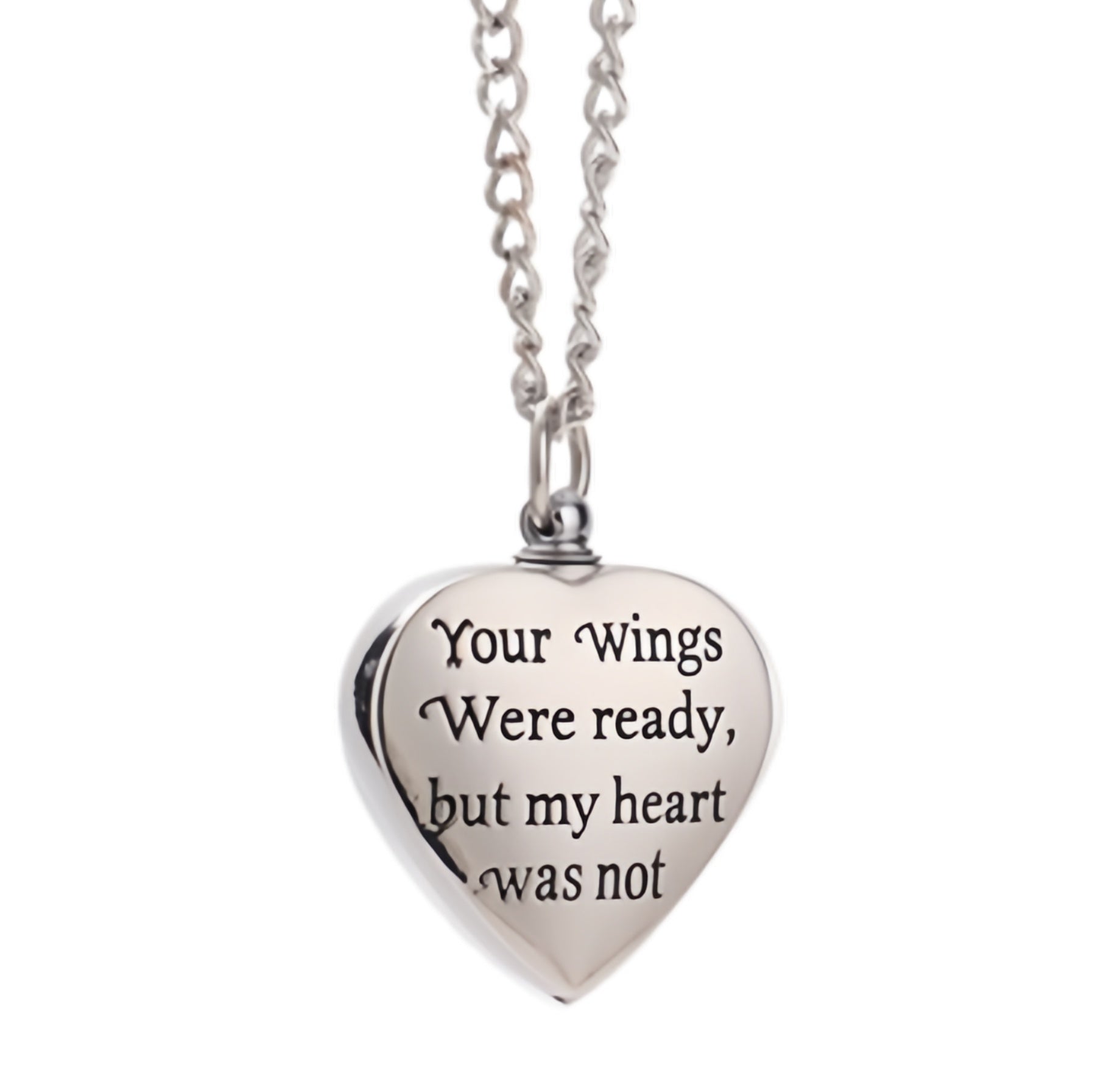 Heart-shaped silver pendant with engraved text on a white background