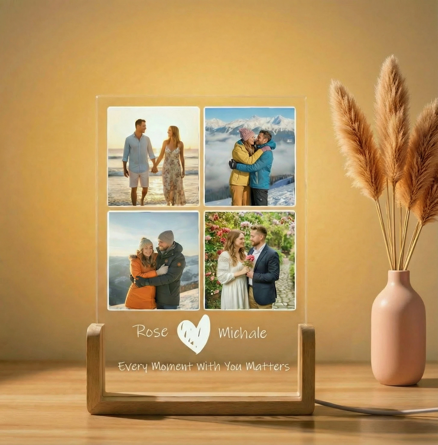 Personalized photo collage display with four images of a couple and engraved names on a wooden stand.