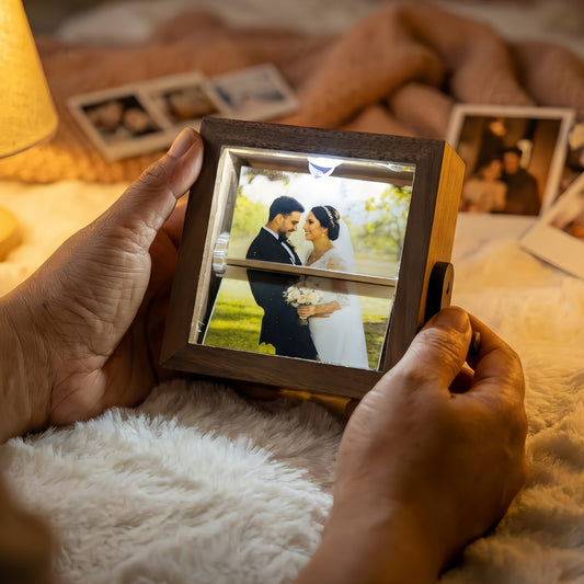 Hands holding a custom wooden photo light box featuring a glowing wedding portrait, perfect for anniversary or Valentine's Day gifts