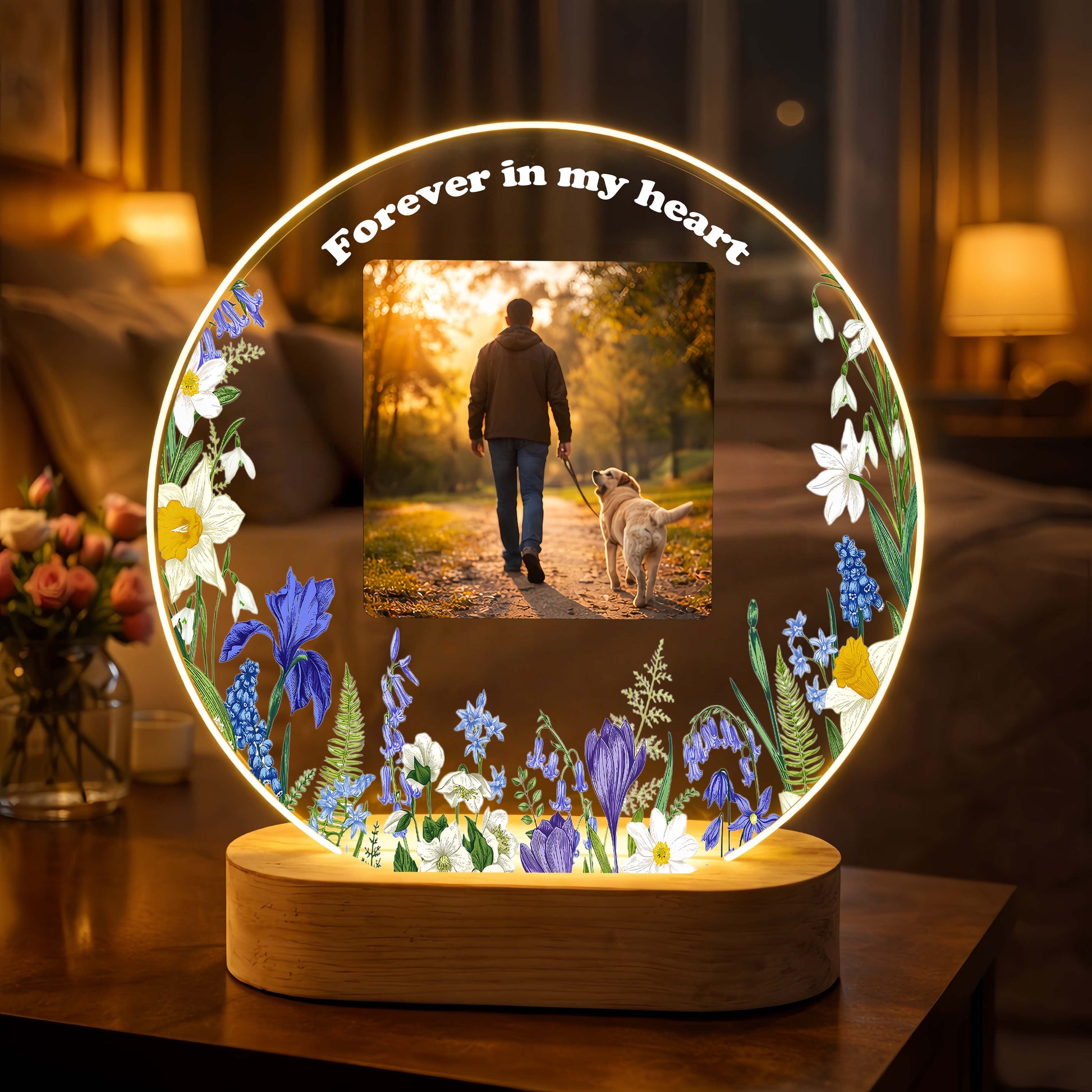Close-up of the glowing LED wood base on a custom cat memorial picture light.